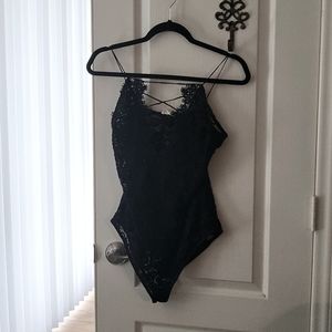 Black and crochet lace bodysuit